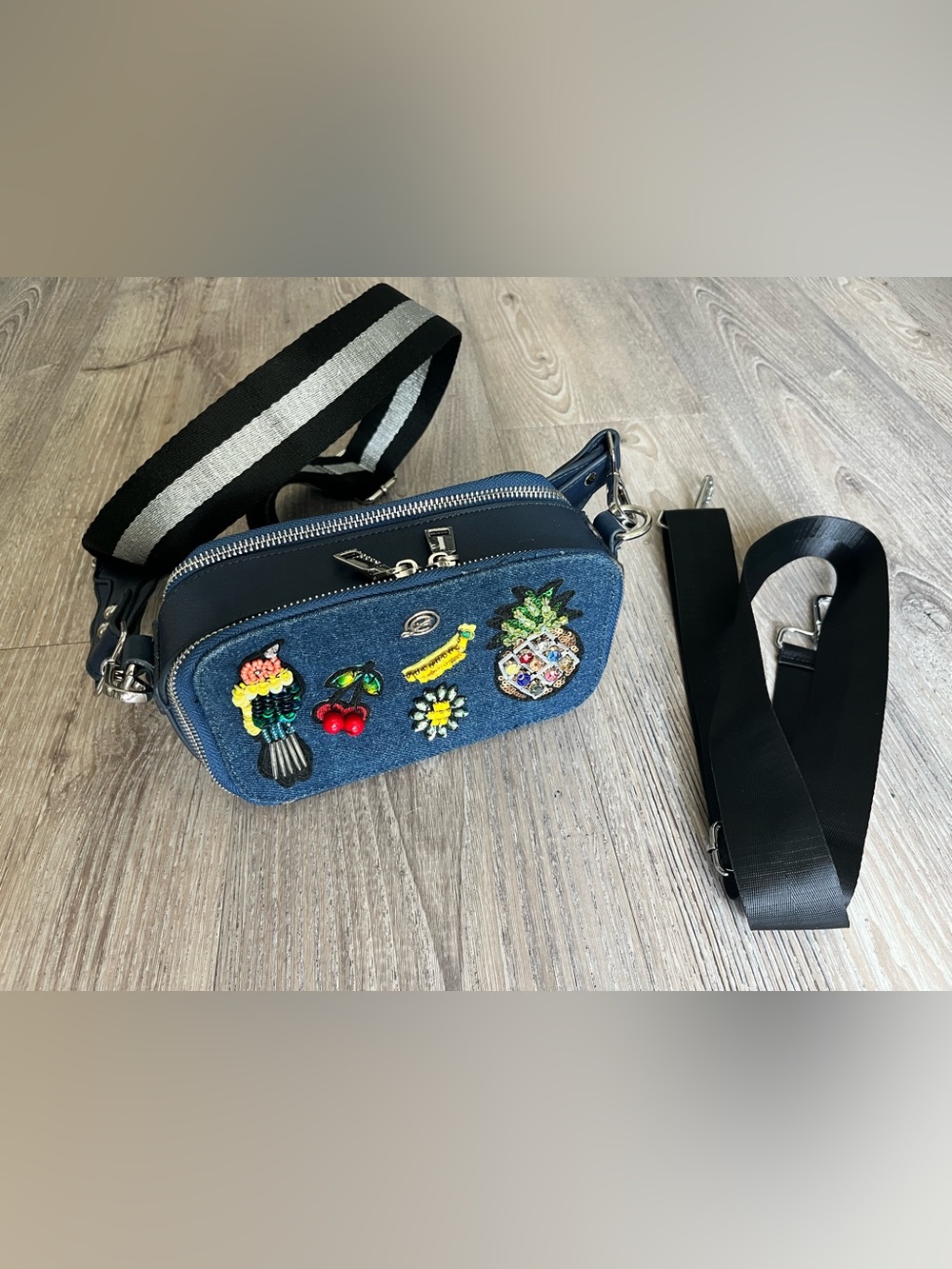 Chinese Laundry denim crossbody bag featuring colorful beaded embellishments.